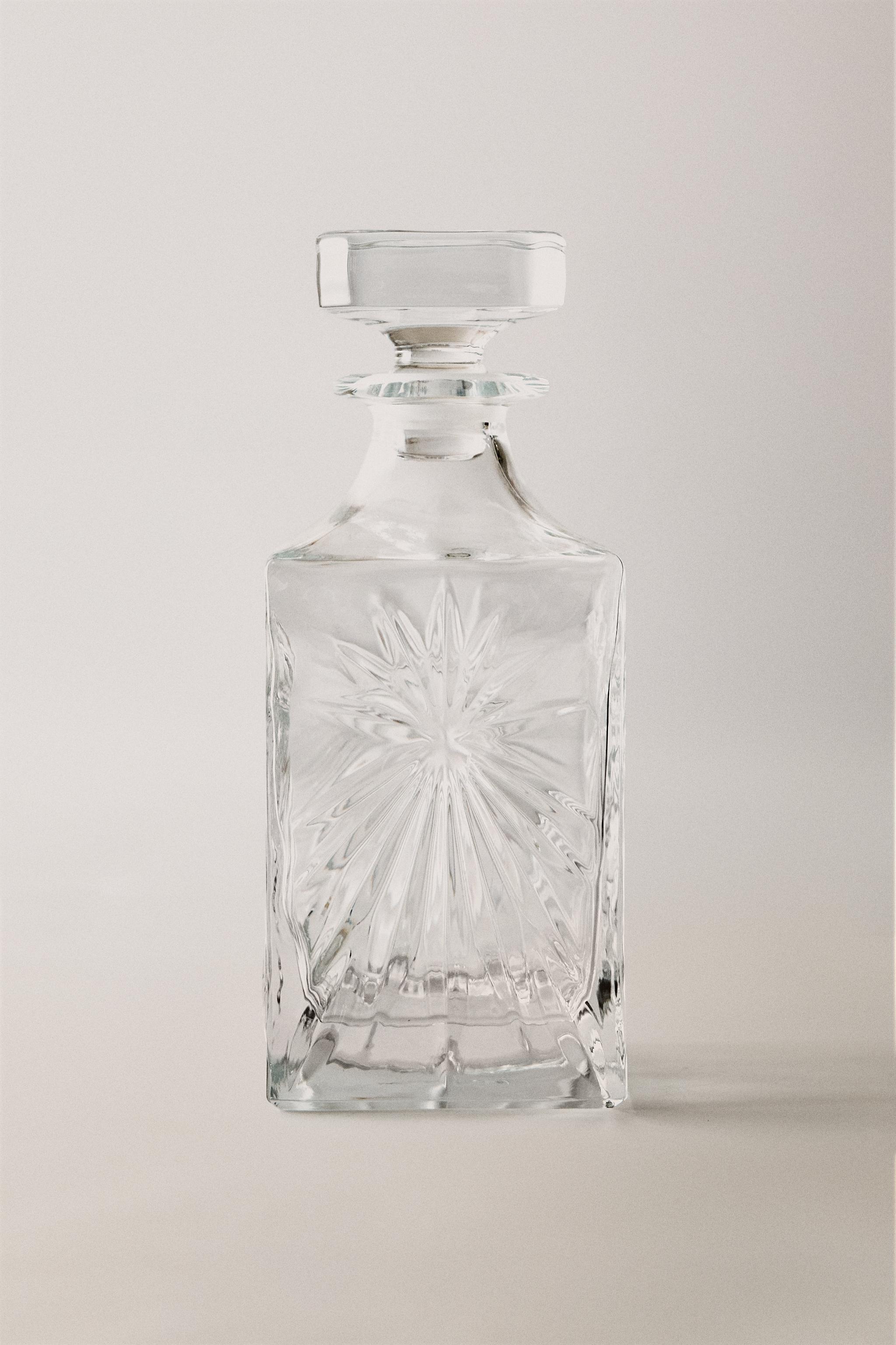 CRYSTALLINE BOTTLE WITH RAISED DESIGN